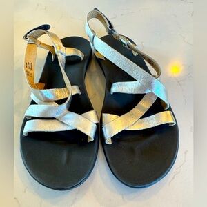 OluKai Women's Sandals in Black and Metallic Silver Straps/ Velcro Close Leather